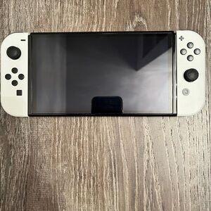 White Handheld Gaming Console with Removable White Controllers - Nintendo